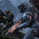 Three Spartans line up with guns in Big Team Battle in Halo Infinite.